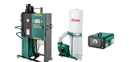 two dust collectors and an air filtration unit on a solid color background